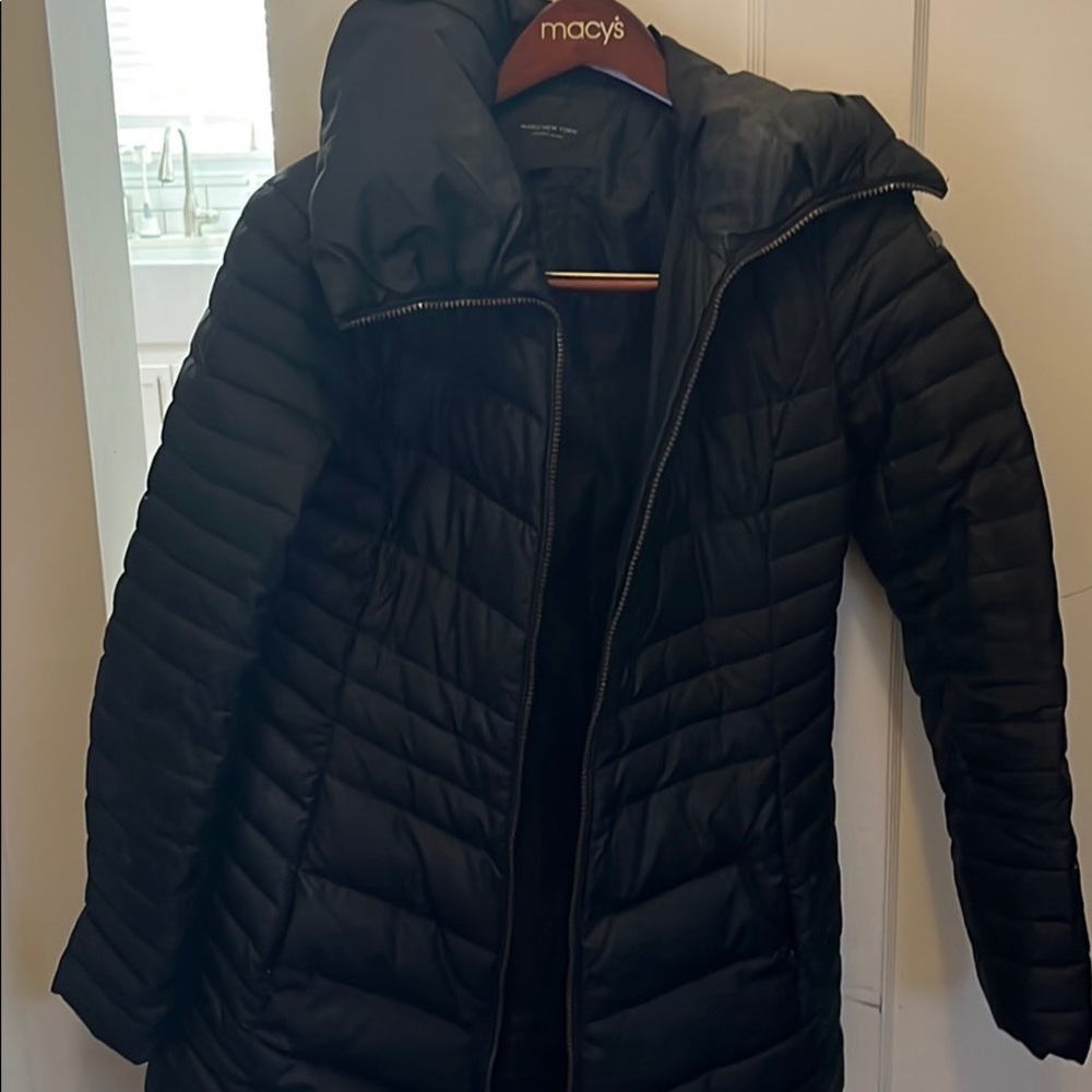 Black winter coat. Length is mid thigh